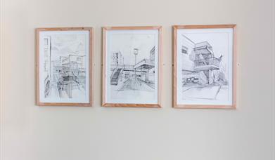Three black and white framed sketches