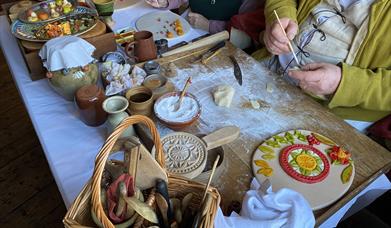 Tudor re-enactors creating Christmas pies