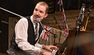 John Carradine playing the piano