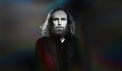 Image shows Rob Auton in black and white looking at the camera.