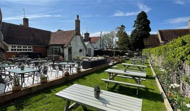 Outdoor seating at The Three Horseshoes Pub