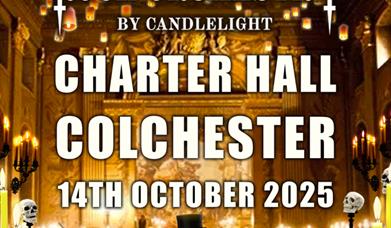 Image shows conductor dressed as a skeleton in a spooky hall with lights and candles.