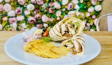 A chicken wrap, coleslaw and crisps.