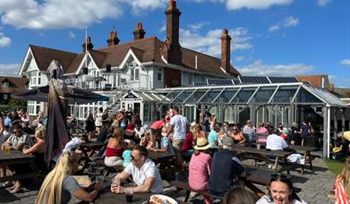 The bustling garden at the Victory pub.