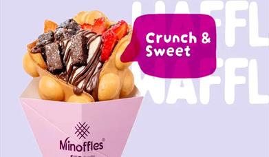 Bubble Waffle with chocolate and strawberries on it